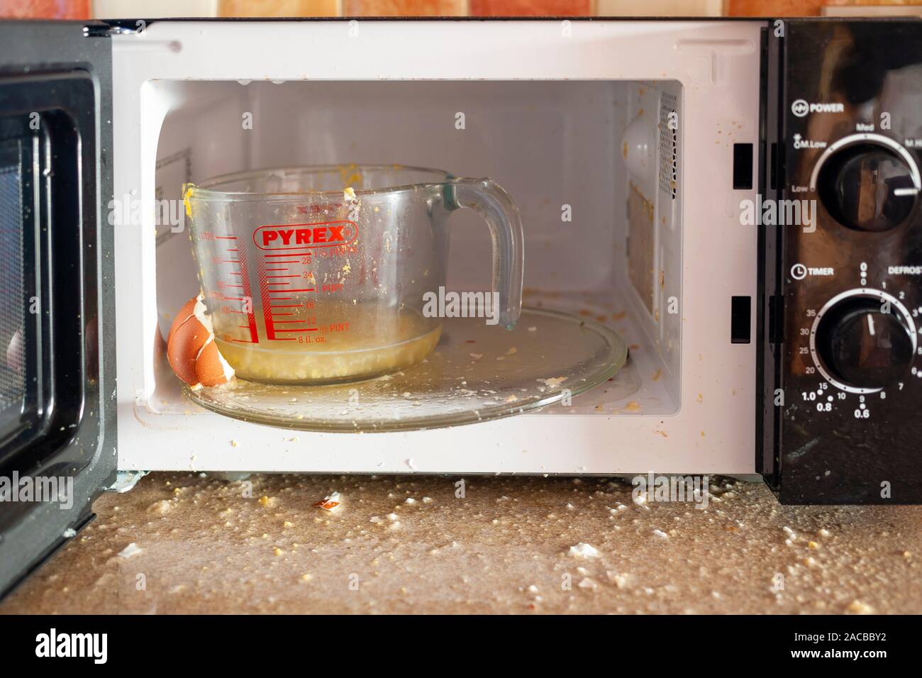 Egg exploded when being boiled in microwave oven Stock Photo