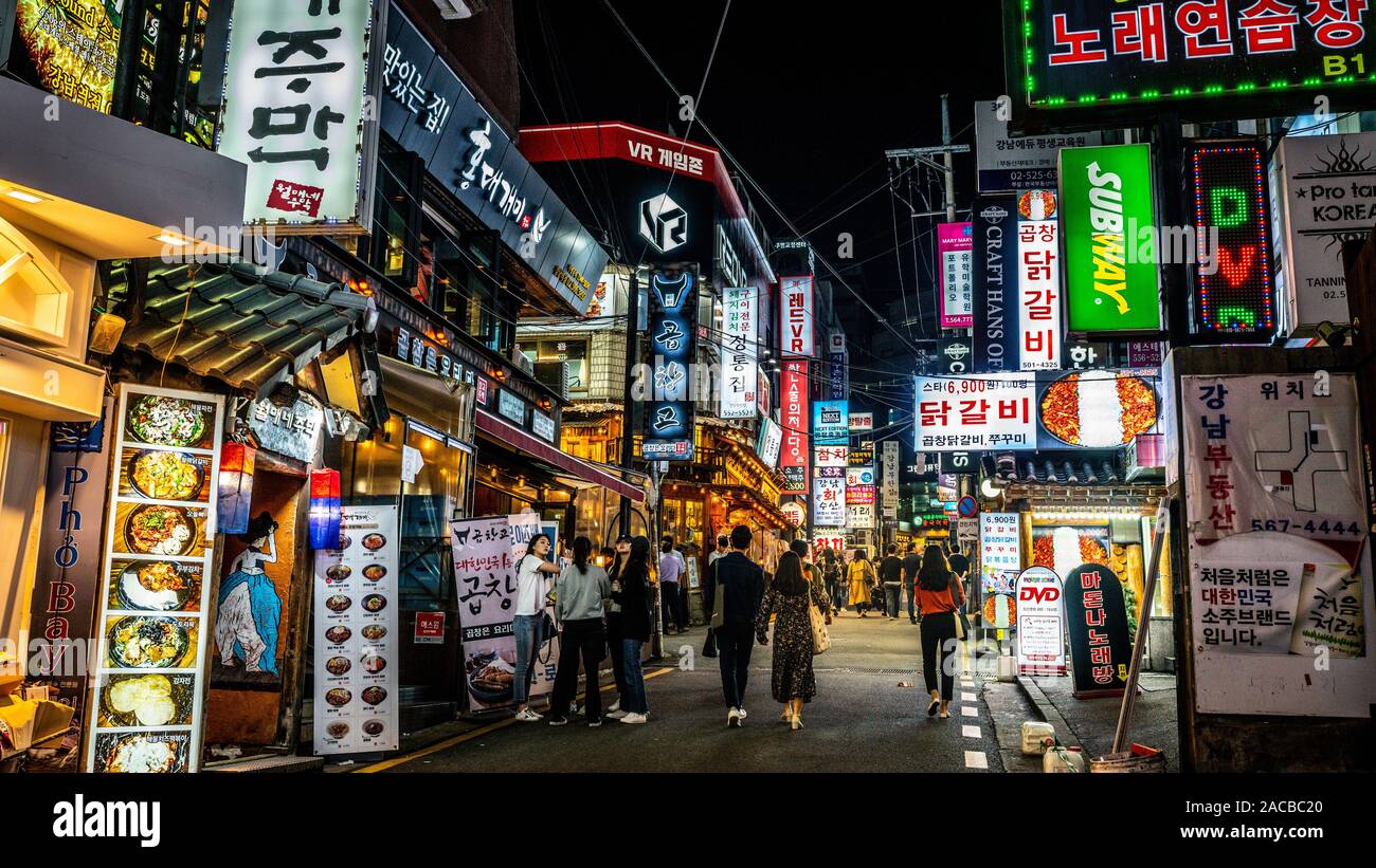 Seoul Korea , 24 September 2019 : Gangnam restaurants and bars pedestrian street view with colourful shop signs and people at night in Seoul South Kor Stock Photo