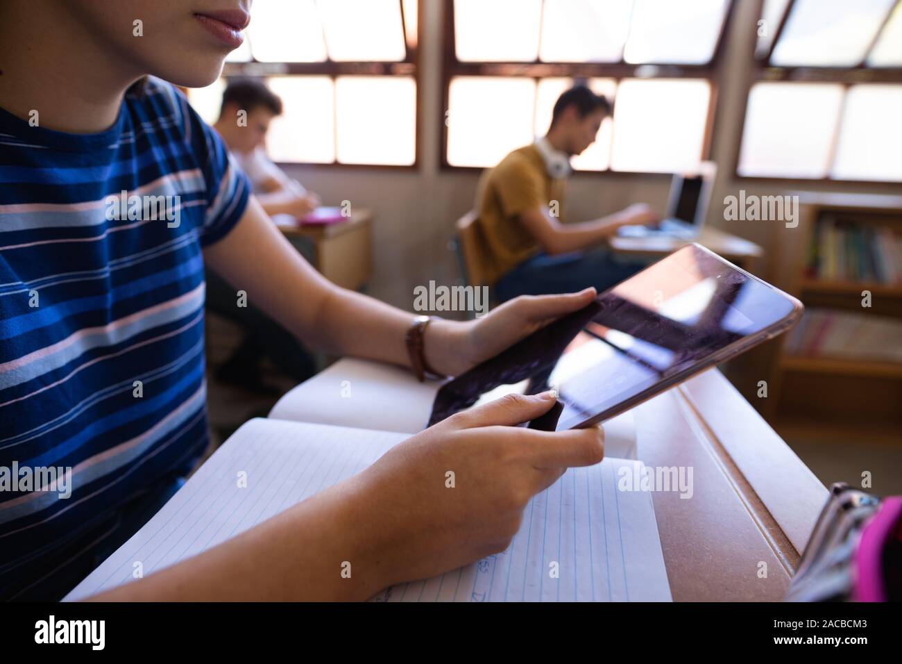 Teenagers in school classroom Stock Photo