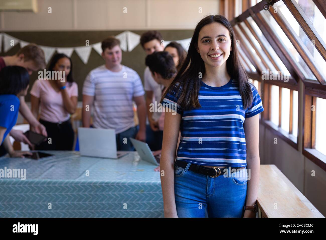 Portrait of teenage girl in school classroom Stock Photo