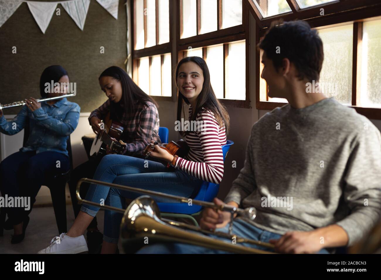 Teenage musicians rehearsing Stock Photo