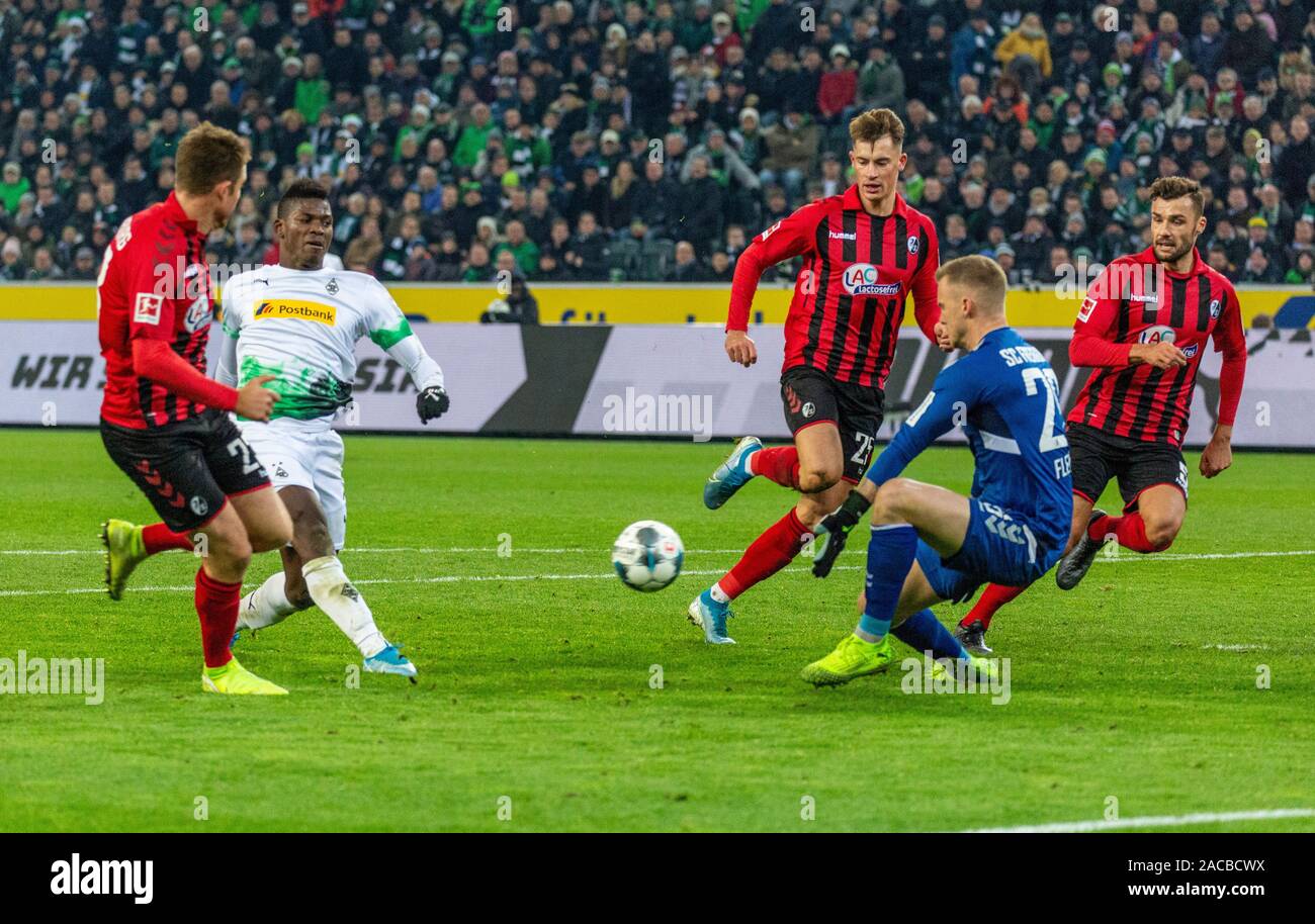 sports, football, Bundesliga, 2019/2020, Borussia Moenchengladbach vs. SC Freiburg 4-2, Stadium Borussia Park, scene of the match, 4-2 goal, f.l.t.r. Dominique Heintz (SCF), goal scorer Breel Embolo (MG), Robin Koch (SCF), keeper Mark Flekken (SCF), Manuel Gulde (SCF), DFL REGULATIONS PROHIBIT ANY USE OF PHOTOGRAPHS AS IMAGE SEQUENCES AND/OR QUASI-VIDEO Stock Photo