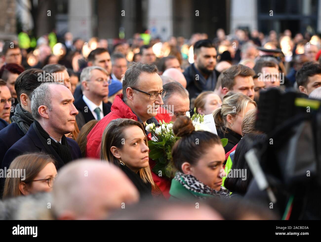 People at a vigil in Guildhall Yard, London, to honour the victims off the London Bridge terror attack, as well as the members of the public and emergency services who risked their lives to help others after a terrorist wearing a fake suicide vest went on a knife rampage killing two people, was shot dead by police on Friday. Stock Photo