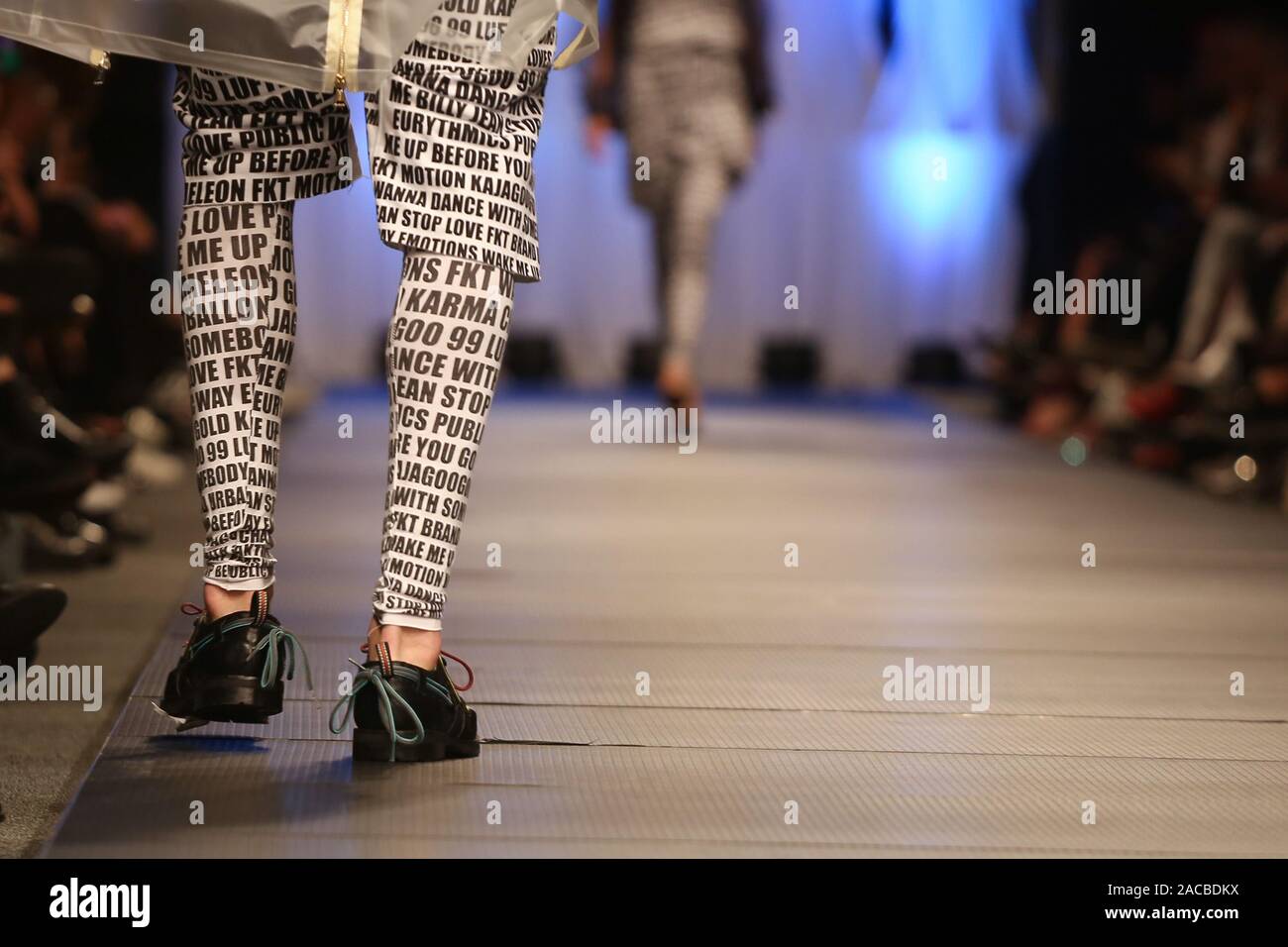 Model walk the runway at Fashion Show. Legs of model on catwalk runway show  event Stock Photo - Alamy