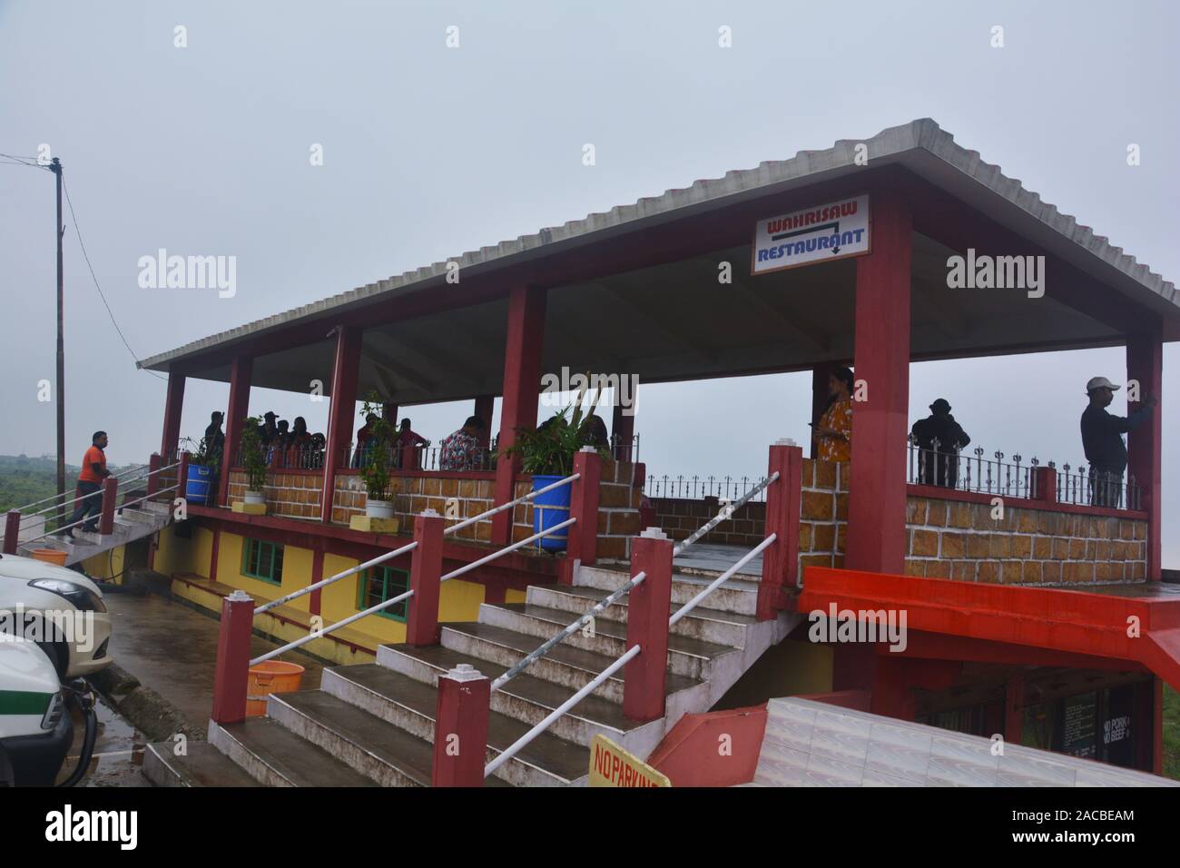 Close up of  the viewing area with shed of the restaurant of Eco Park of  Cherrapunjee, Shillong with stairs and people, selective focusing Stock Photo