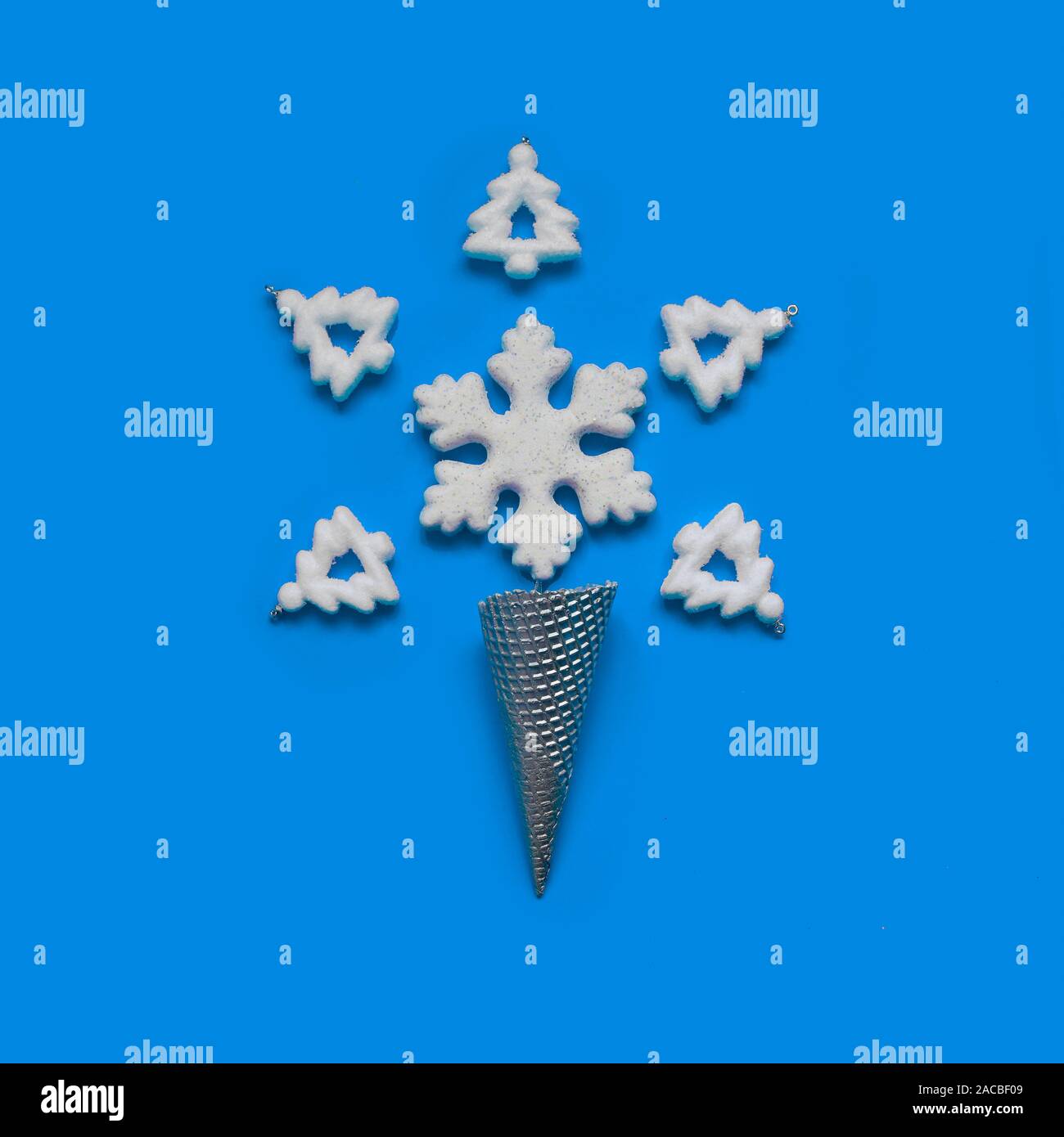 Minimum Christmas.Cream cone silver with snowflake and trees Stock Photo