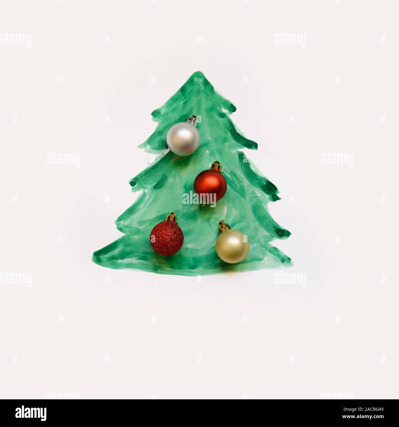 Painted Christmas tree with Christmas balls on white background Stock Photo