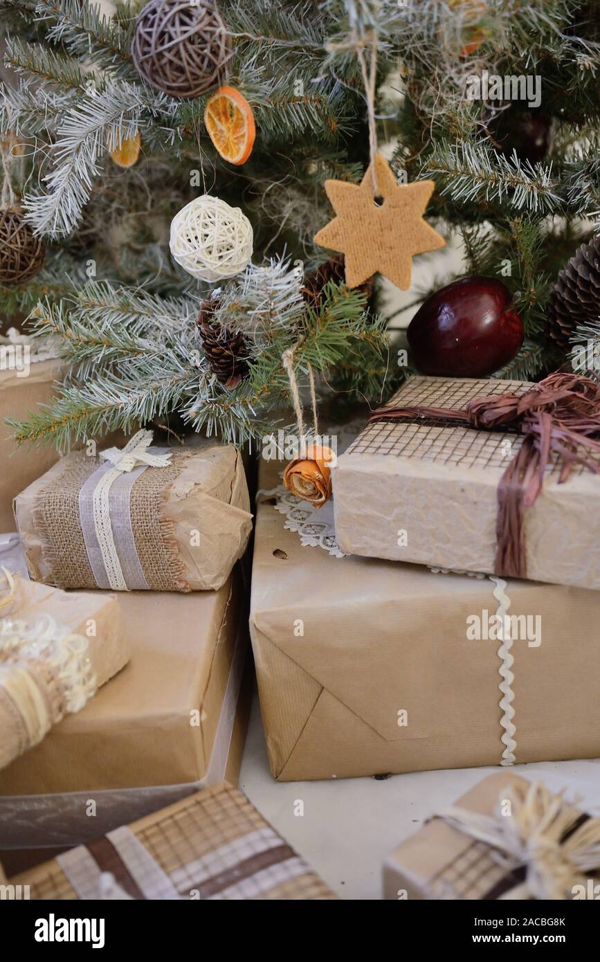 Christmas Hanging decoration. Rustic style. Part of Christmas tree with gifts Stock Photo