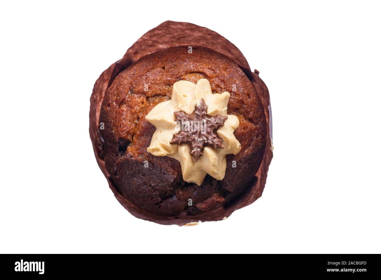 Salted caramel muffin with chocolate star decoration fresh from M&S in-store bakery isolated on white background Stock Photo