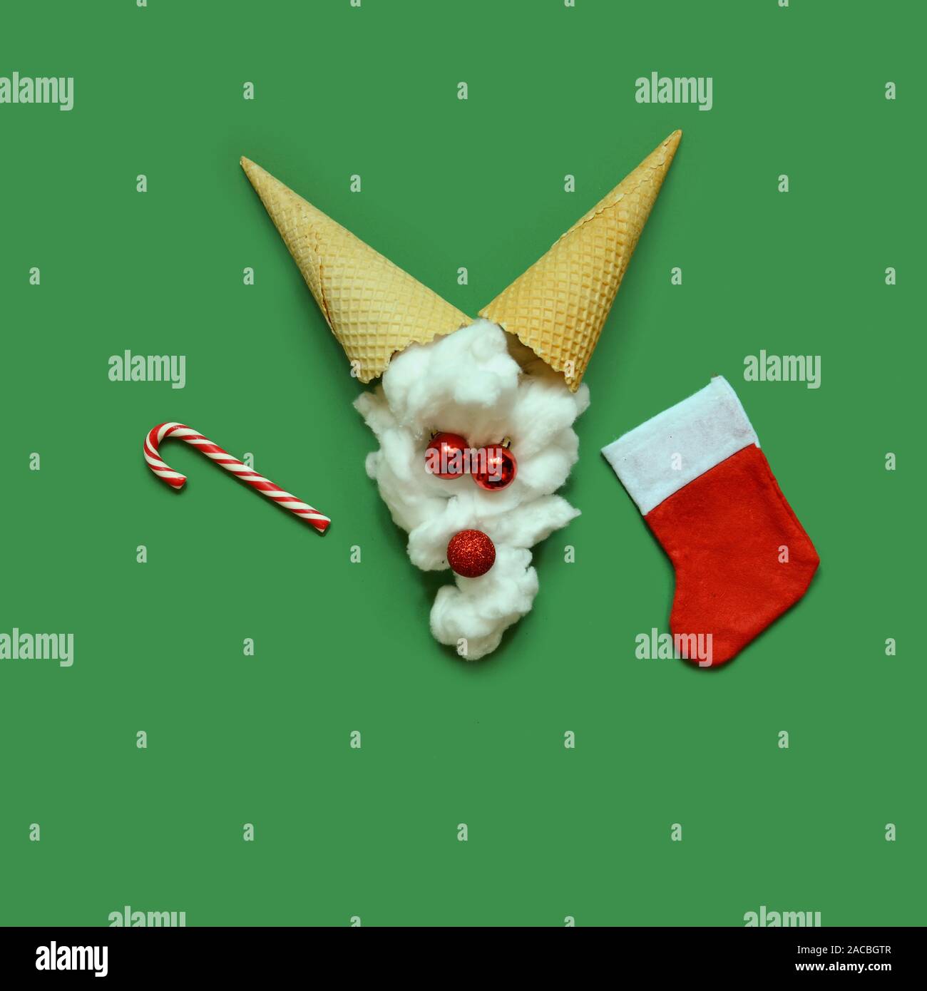 Santas reindeer made with Christmas bauble decoration and ice cream cones . Minimal flat lay Christmas concept. Stock Photo
