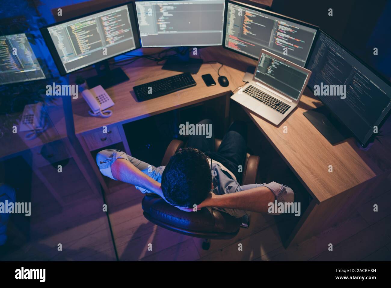 Hign angle above view photo of it skilled specialist guy sitting comfy