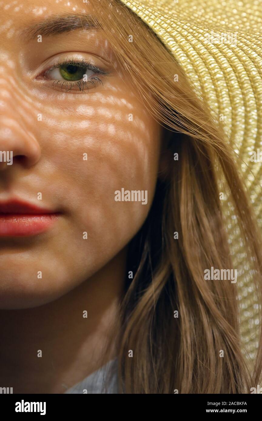 Closeup of Young Girl with Summer Hat Stock Photo