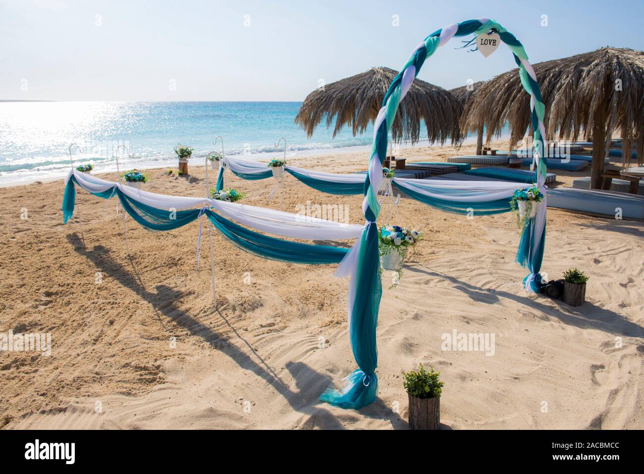 Setup Of Wedding Day Marriage Aisle With Drapes And Arch On Sandy