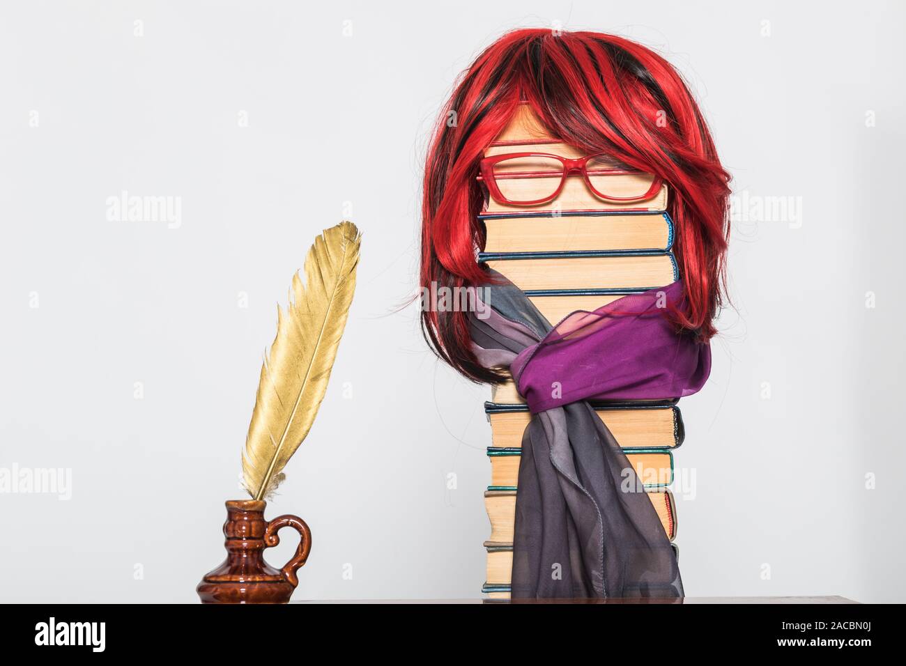 Funny education concept with beautiful teacher girl with luxurious red hair Stock Photo
