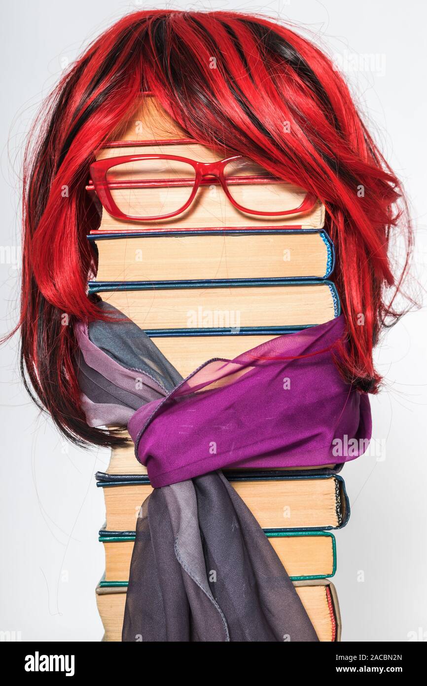 Funny education concept with beautiful teacher girl with luxurious red hair Stock Photo