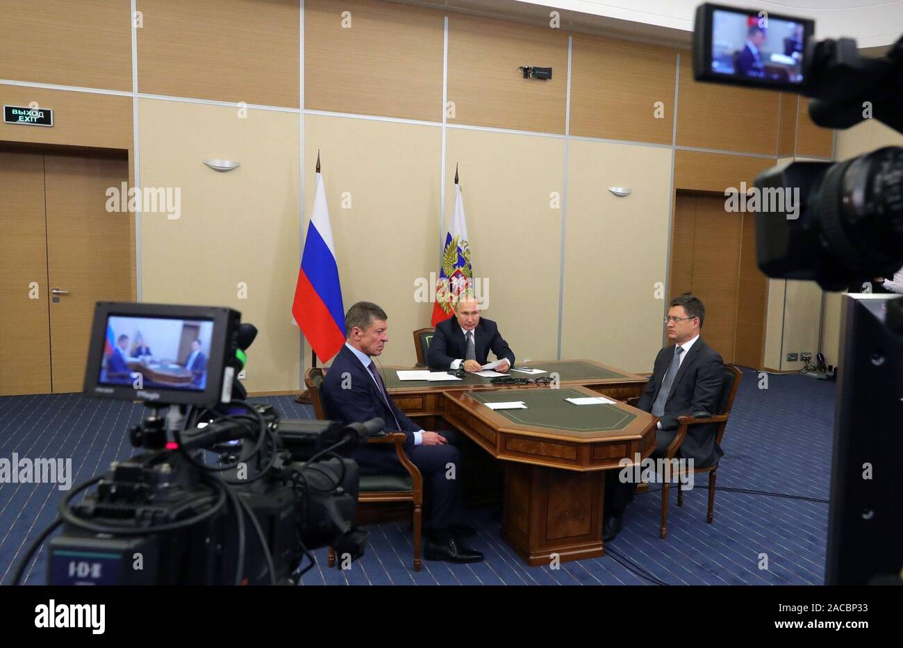 Moscow, Russia. 02nd Dec, 2019. Russian President Vladimir Putin (C), Russian Energy Minister Alexander Novak (R) and Deputy Prime Minister Dmitry Kozak watch the launching ceremony of the China-Russia east-route natural gas pipeline via teleconference in Sochi, Russia, Dec. 2, 2019. Chinese President Xi Jinping had a video call with his Russian counterpart Vladimir Putin Monday afternoon, as the two heads of state jointly witnessed the launching ceremony of the China-Russia east-route natural gas pipeline. (Sputnik/Handout via Xinhua) Credit: Xinhua/Alamy Live News Stock Photo