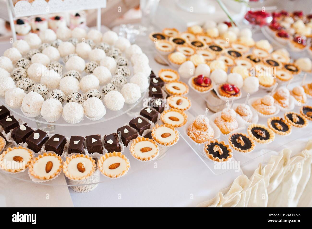 Dessert Table Of Delicious Sweets On Wedding Reception Stock Photo