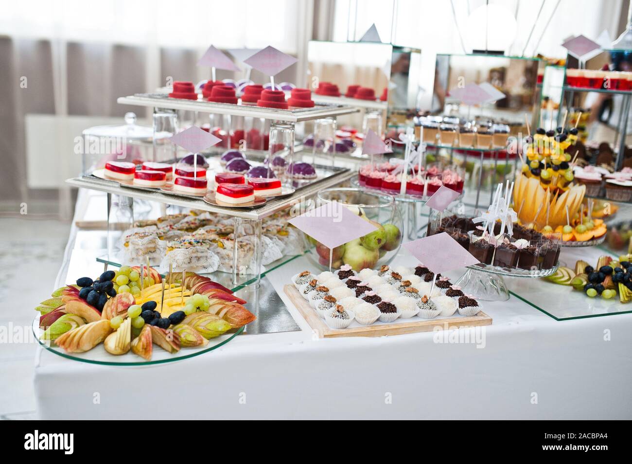 Dessert Table Of Delicious Sweets On Wedding Reception Stock Photo