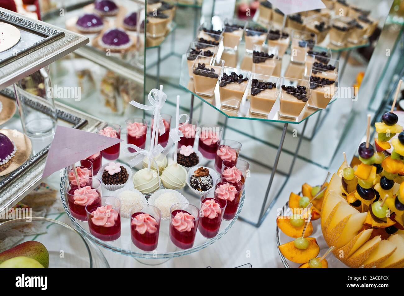 Dessert Table Of Delicious Sweets On Wedding Reception Stock Photo