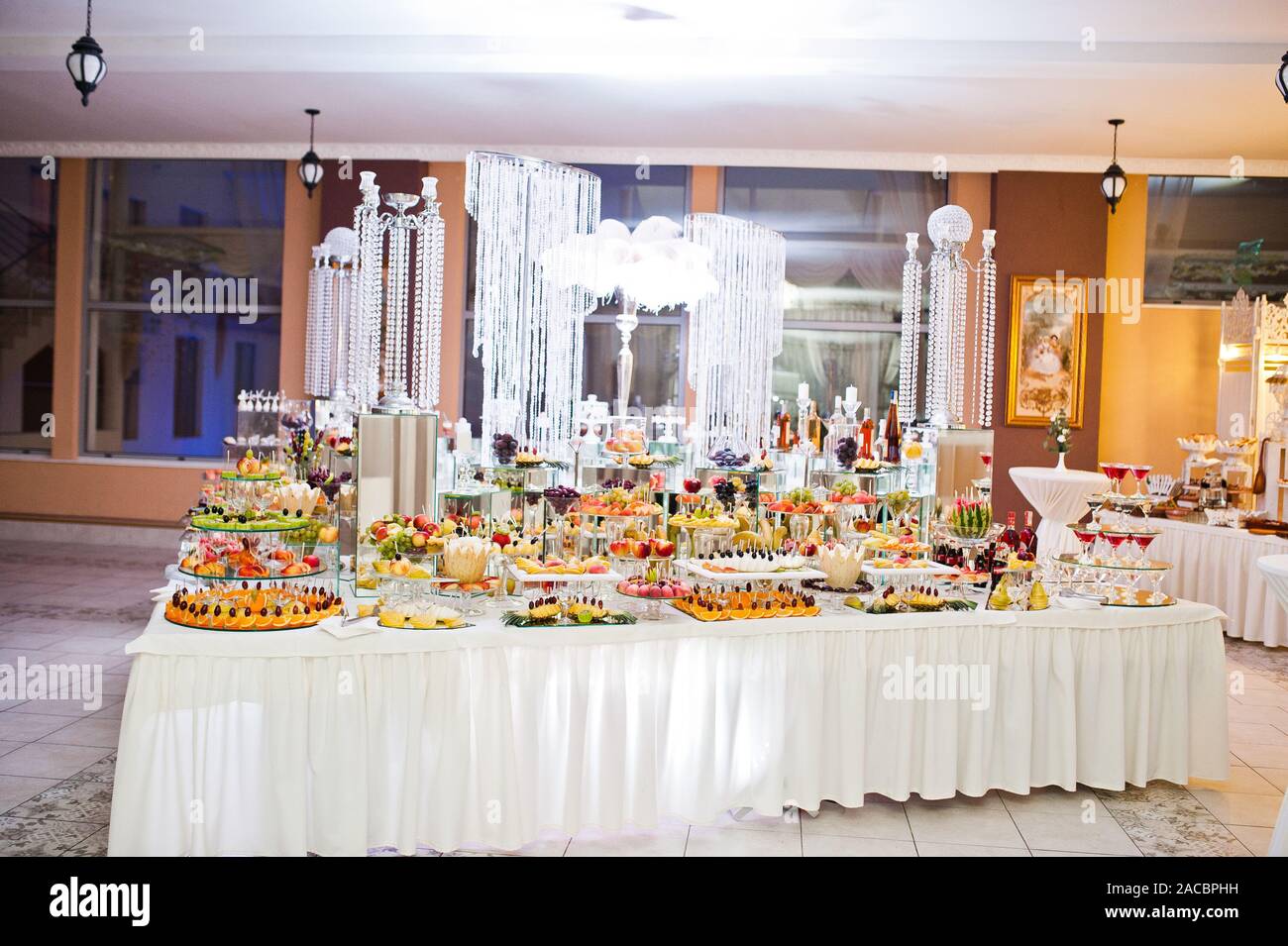Dessert Table Of Delicious Sweets On Wedding Reception Stock Photo