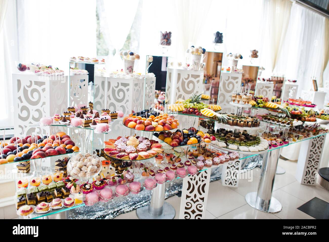 Dessert Table Of Delicious Sweets On Wedding Reception Stock Photo