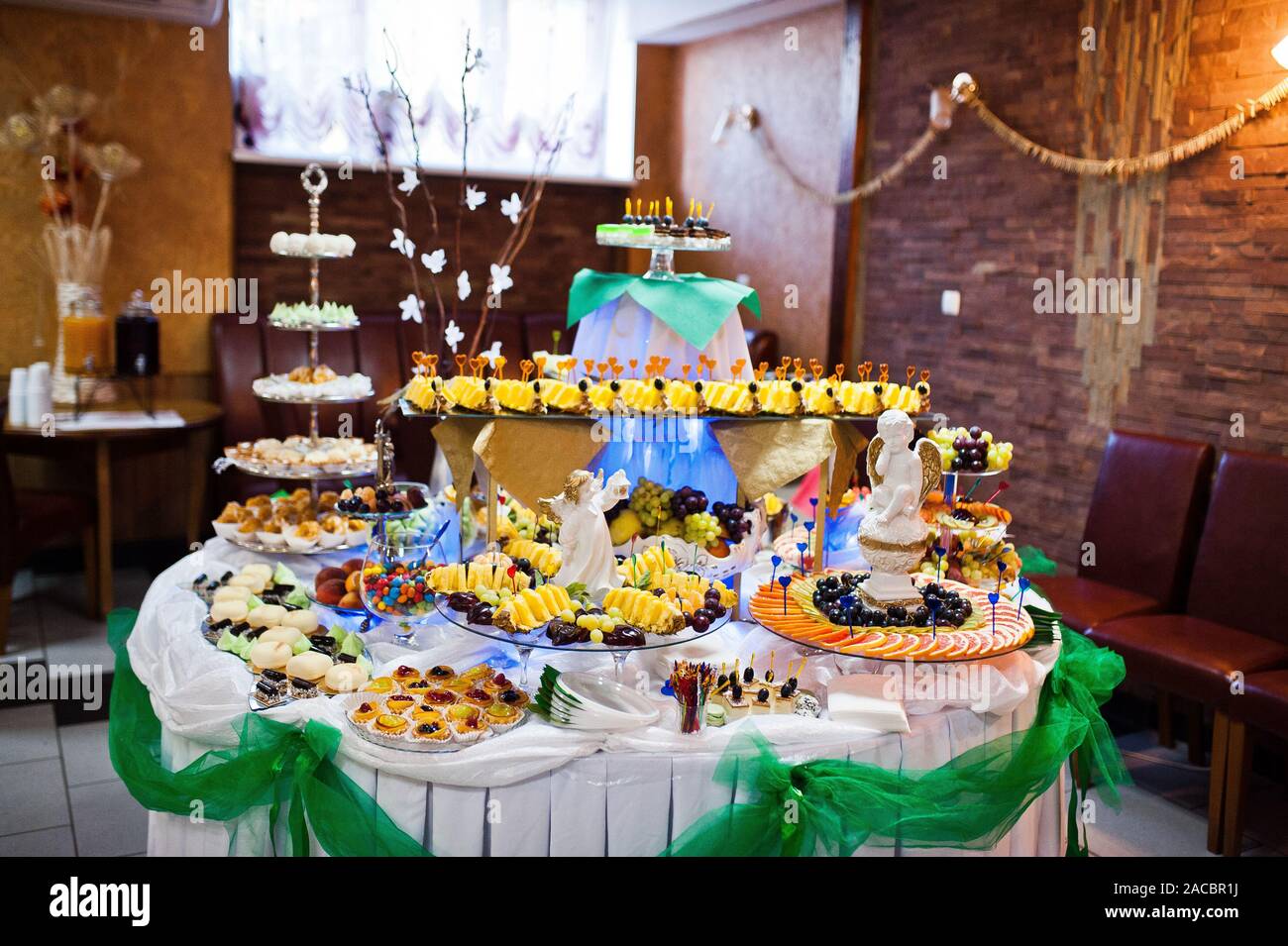 Dessert Table Of Delicious Sweets On Wedding Reception Stock Photo