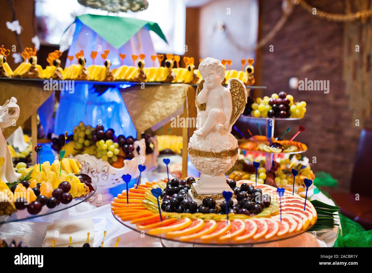Dessert Table Of Delicious Fruits On Wedding Reception Stock Photo