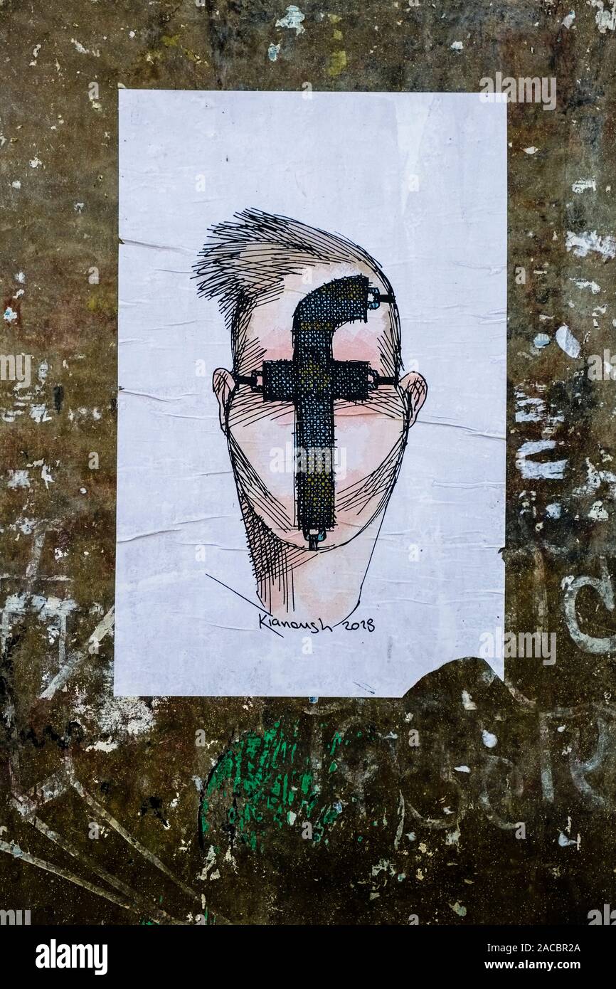 Griffiti of a male face with a Facebook symbol at a wall Stock Photo