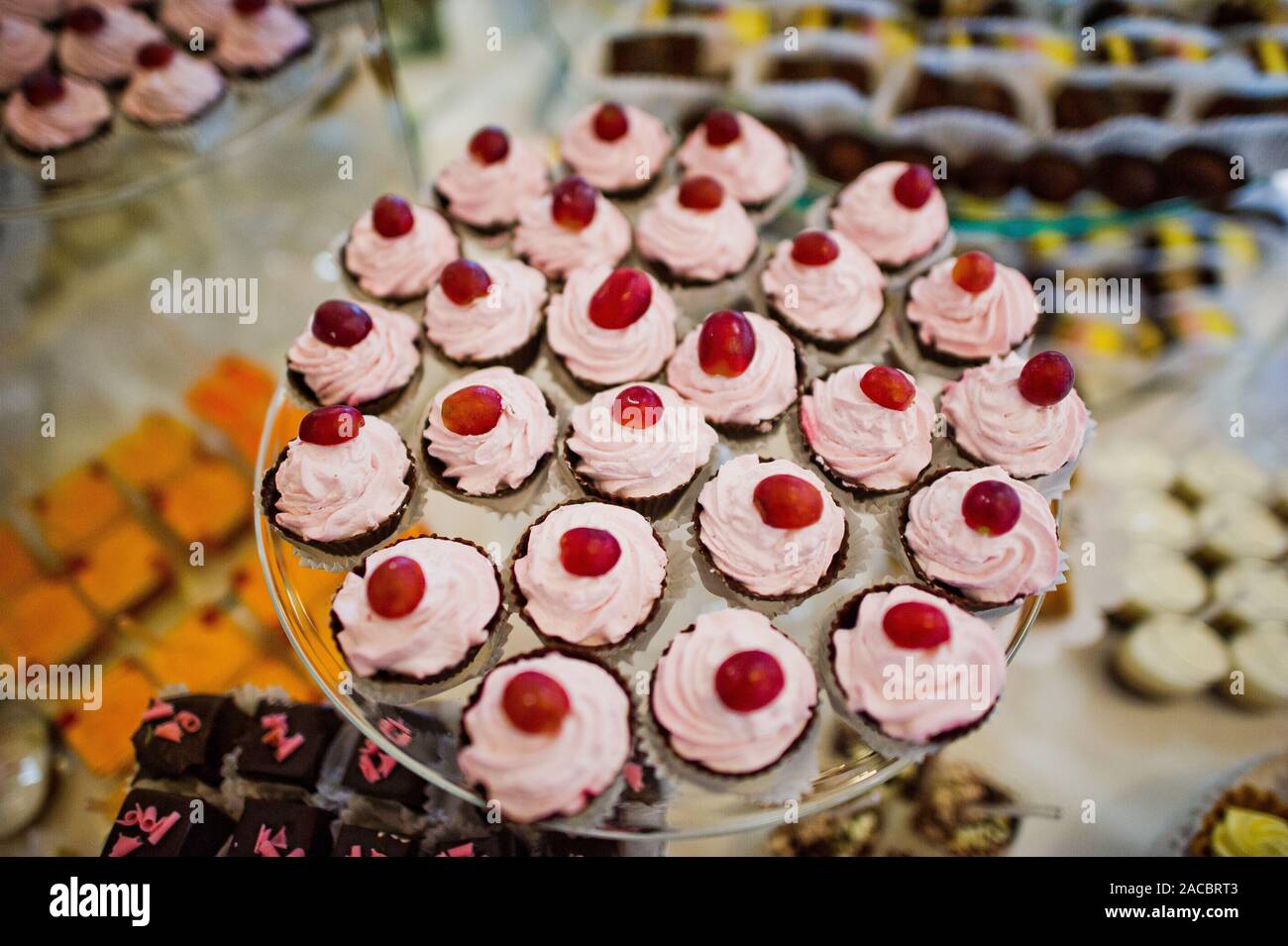 Dessert Table Of Delicious Sweets On Wedding Reception Stock Photo