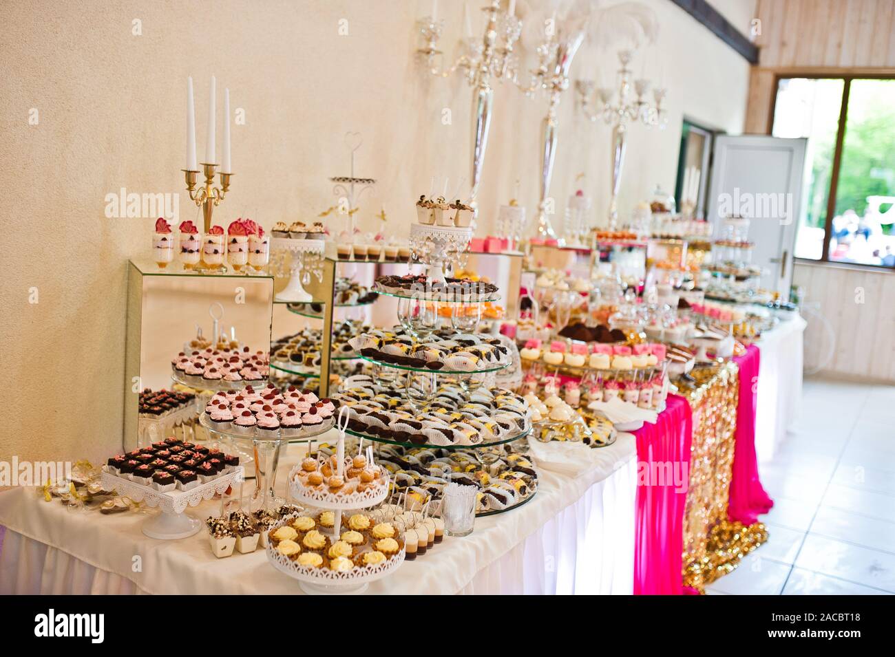 Dessert Table Of Delicious Sweets On Wedding Reception Stock Photo