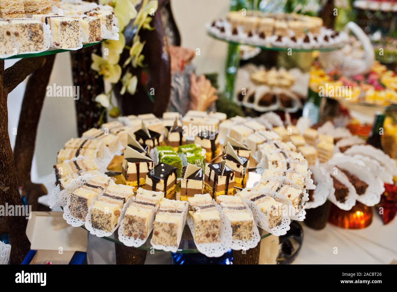 Dessert Table Of Delicious Sweets On Wedding Reception Stock Photo