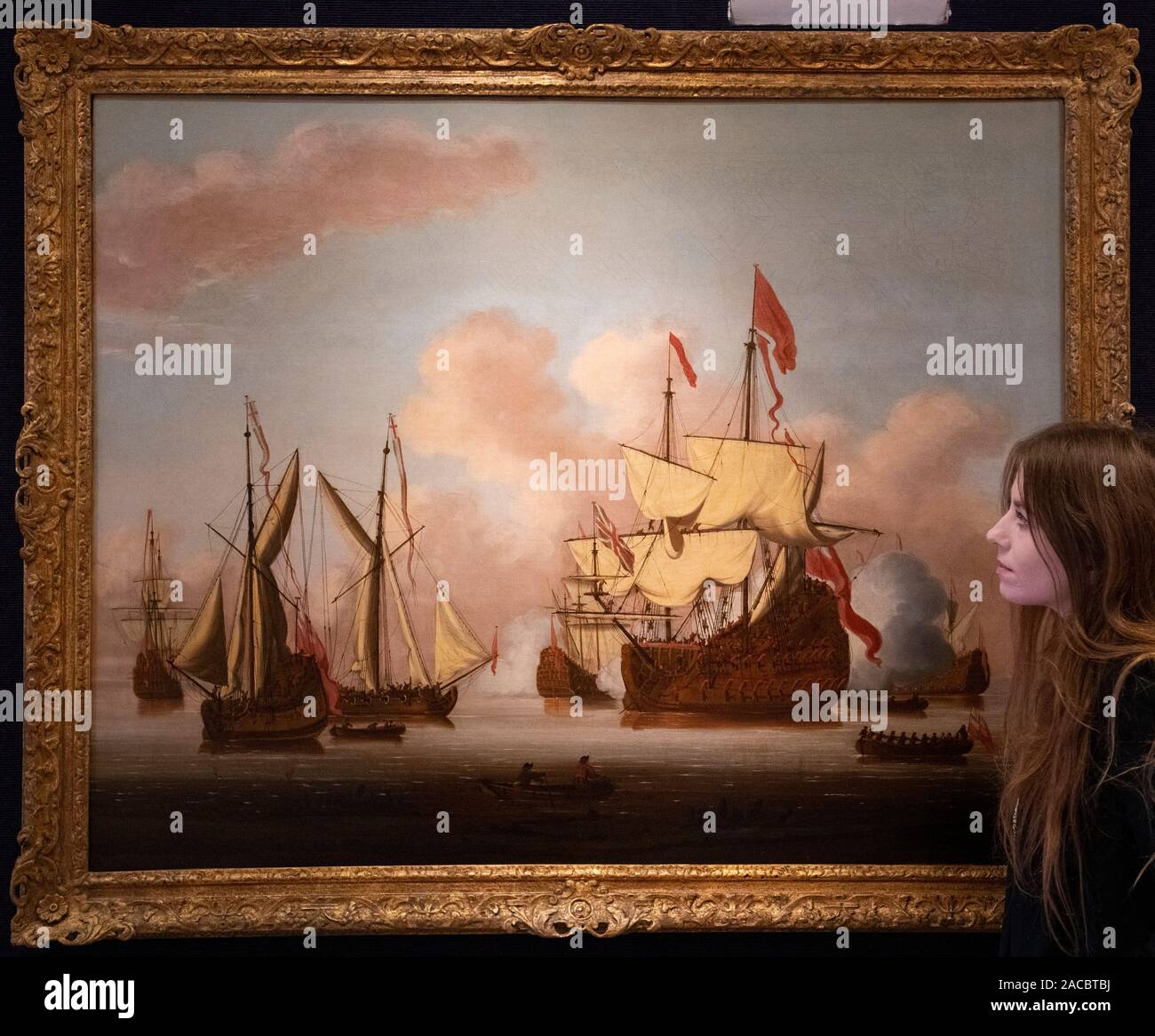 Bonhams, London, UK. 2nd December 2019. Old Masters Painting sale preview at Bonhams. Image: Cornelis van de Velde (Greenwich 1675-1729). A ship of the line of the Red Squadron firing a salute among various yachts. Estimate: £15,000-20,000. Credit: Malcolm Park/Alamy Live News. Stock Photo
