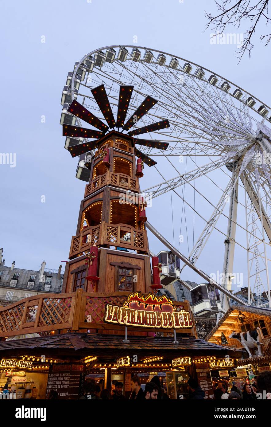 Paris France November 30 19 Giant Wooden Tower And A Big Wheel In The Background In The Christmas Market At The Tuileries Garden In Paris Stock Photo Alamy