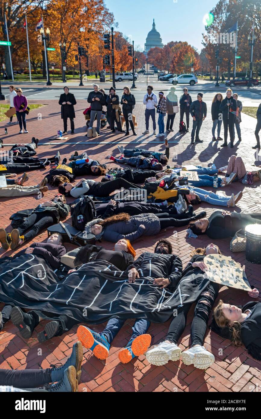 Washington, DC - Young activists staged a 'die-in' during a 'Funeral for Future' on Capitol Hill. They demanded that governments address the crisis of Stock Photo