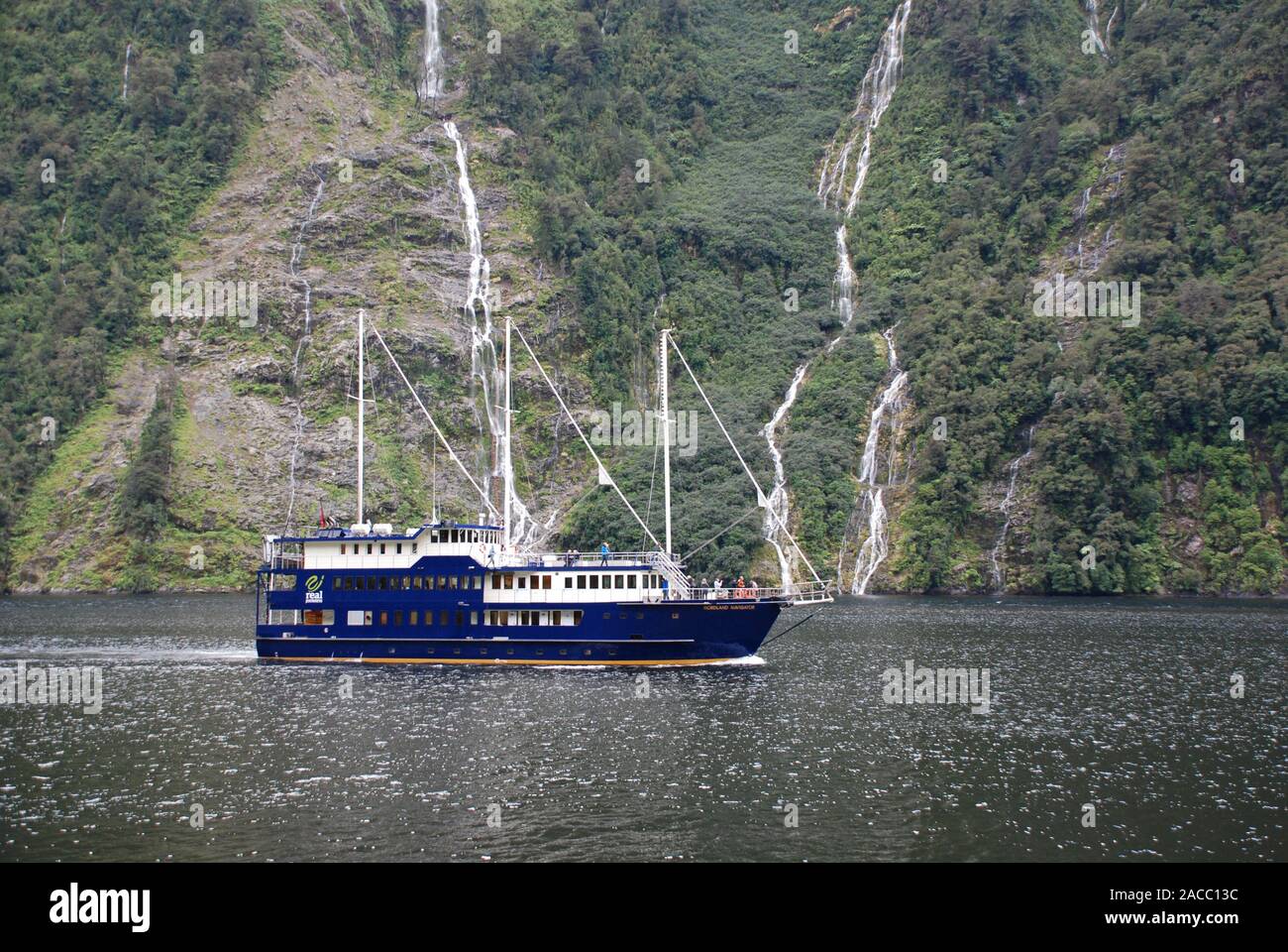 Cruise ship on Doubtful Sound, New Zealand Stock Photo