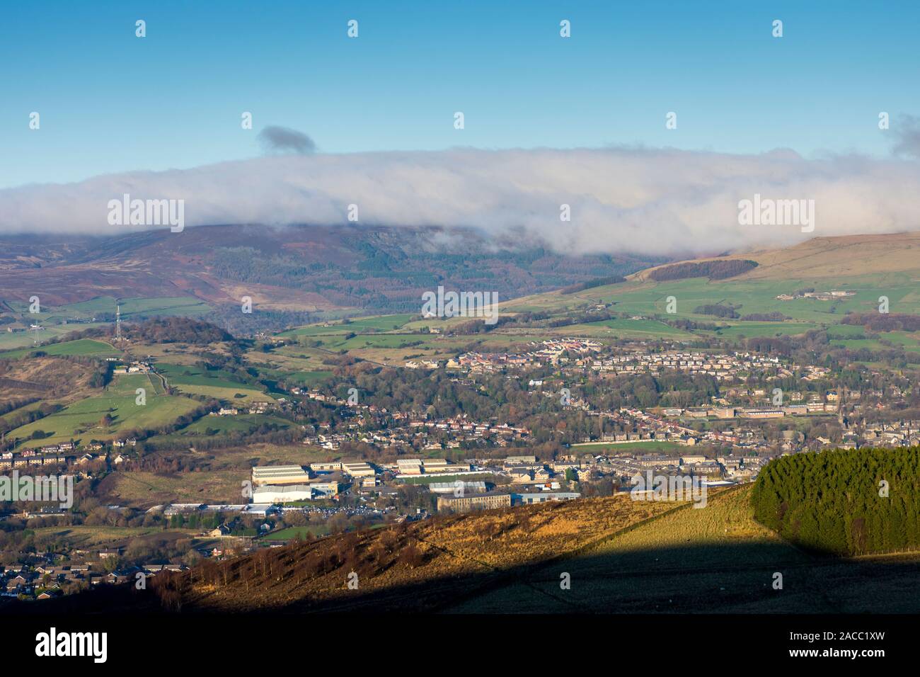 The mist covered Black Hill plateau from Cown Edge, over Glossop, Derbyshire, England, UK Stock Photo