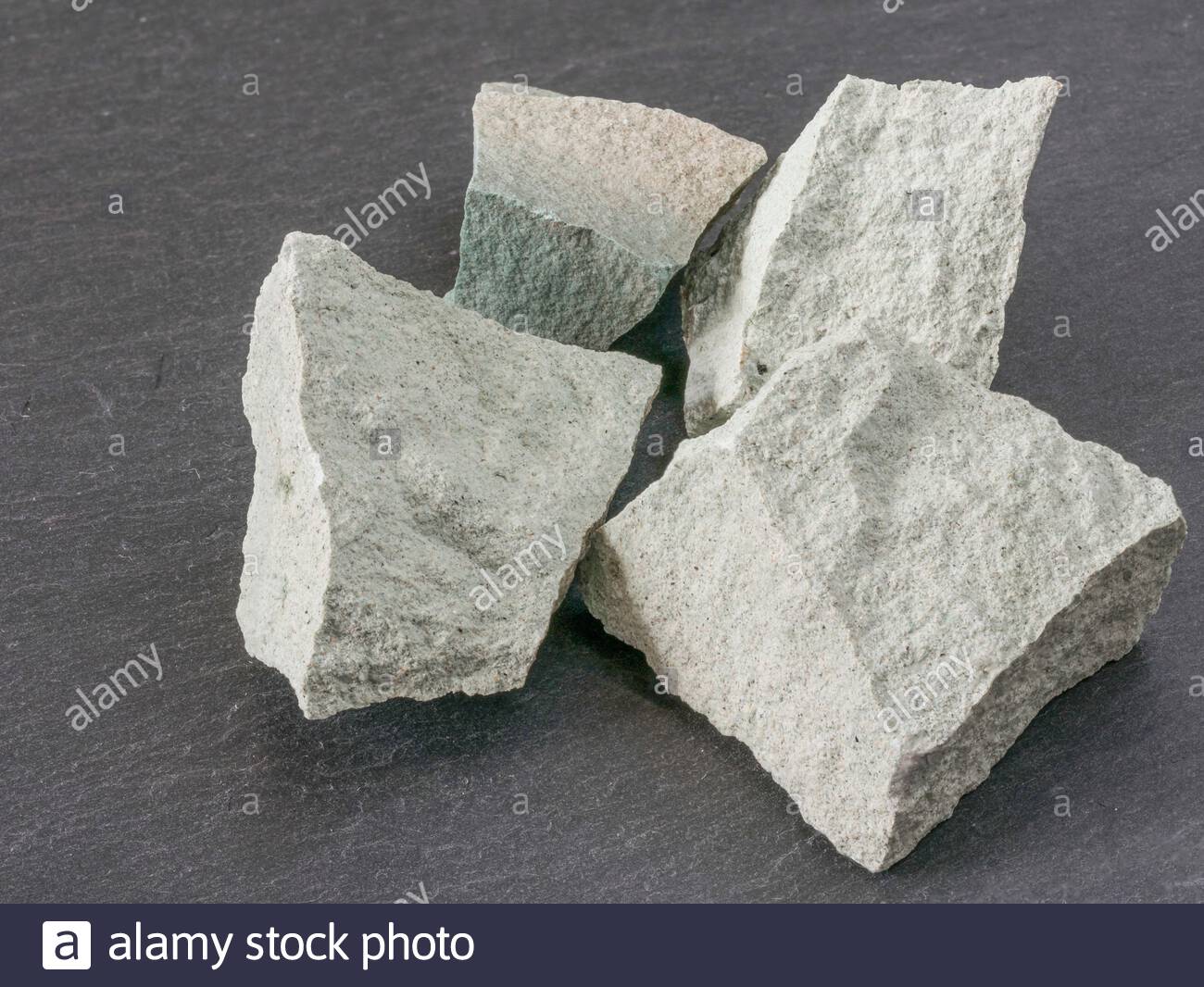 Zeolite Natural Raw Stones On Black Background Macro Shot Stock