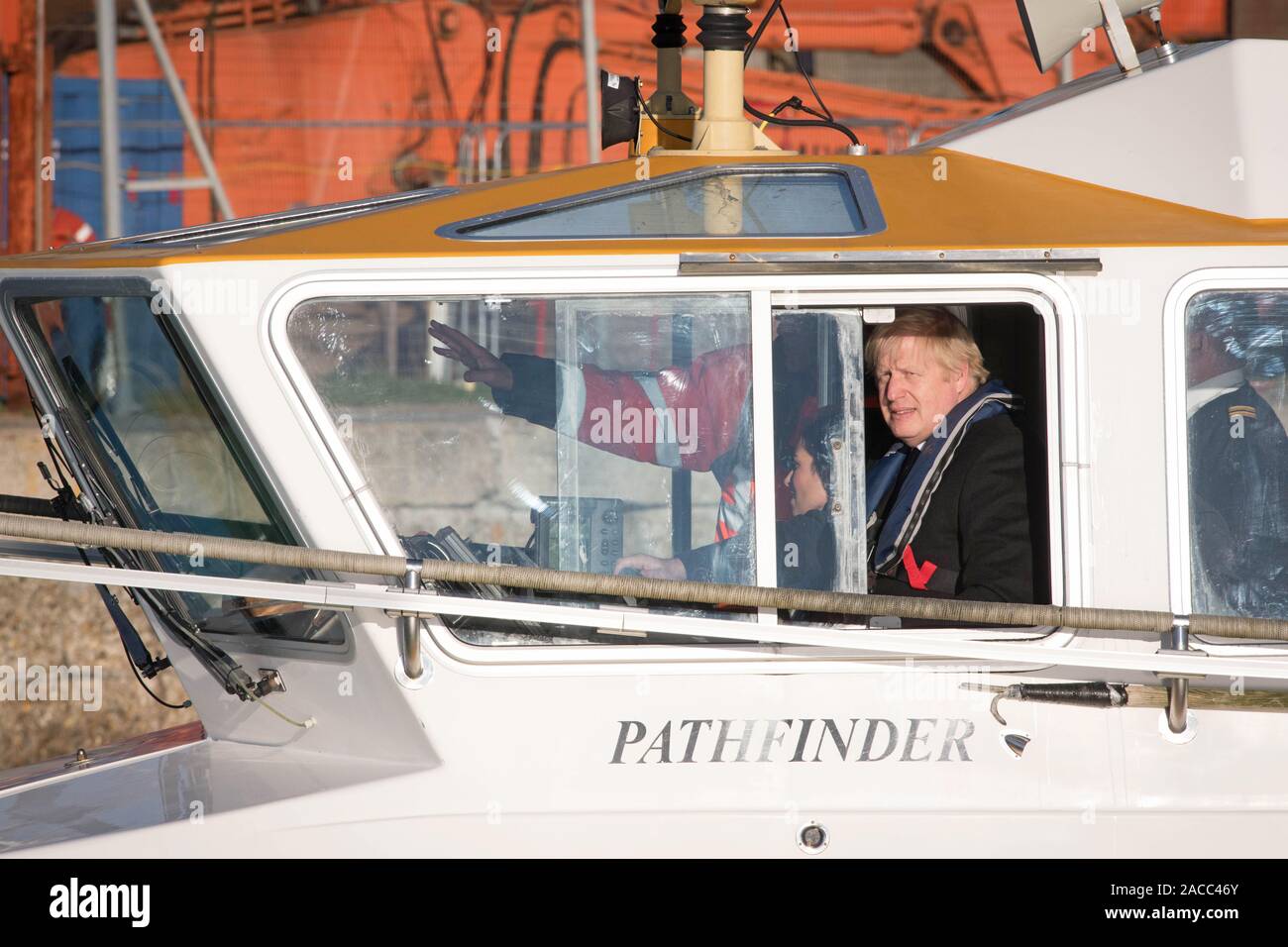 Prime Minister Boris Johnson onboard a boat during a visit to the Port ...