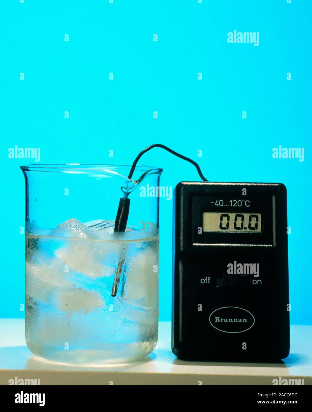 A digital thermometer showing the temperature of melting ice in a flask. Ice melts at 0 Celsius