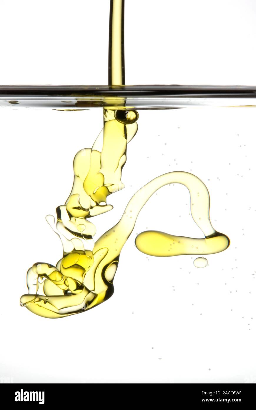 Oil and water. Highspeed photograph of oil being poured onto water