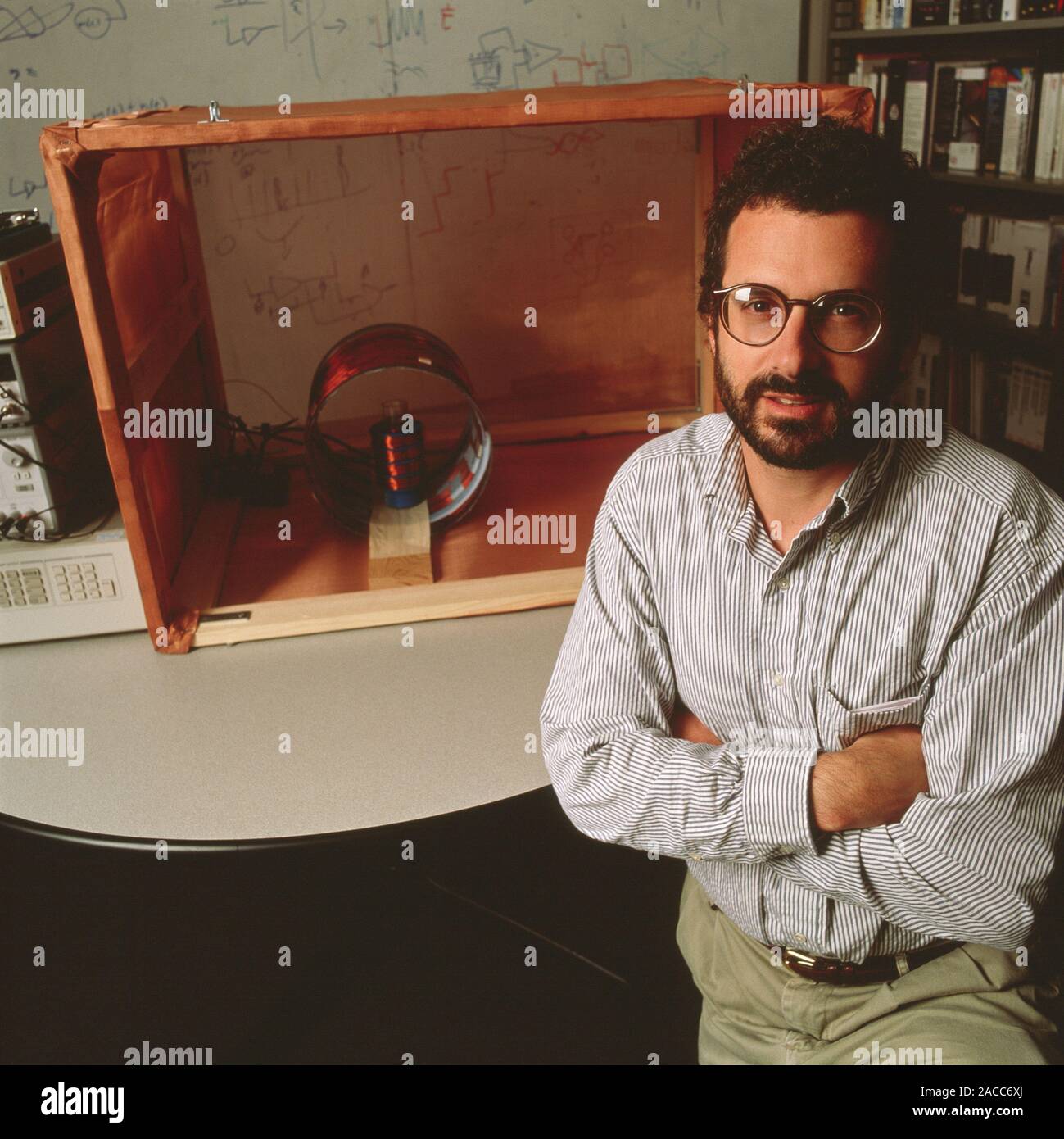 Quantum computer prototype. Researcher Neil Gershenfeld with his