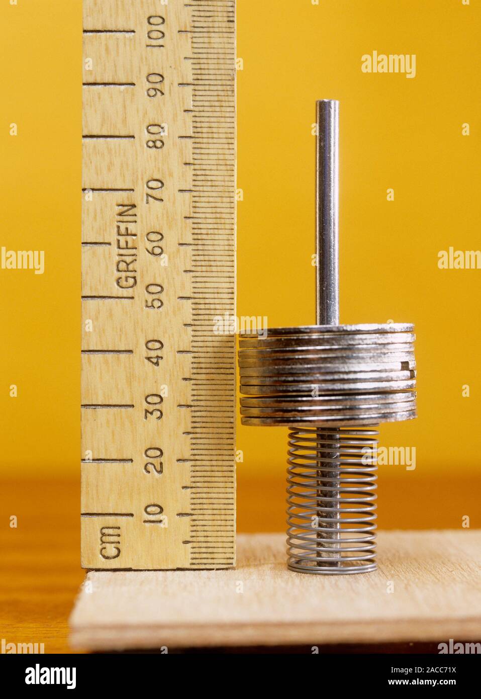 Compressed spring. Image 3 of 3. This spring is being used for a