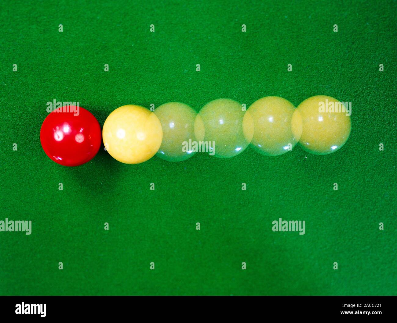 Billiard balls colliding, demonstrating principles such as conservation