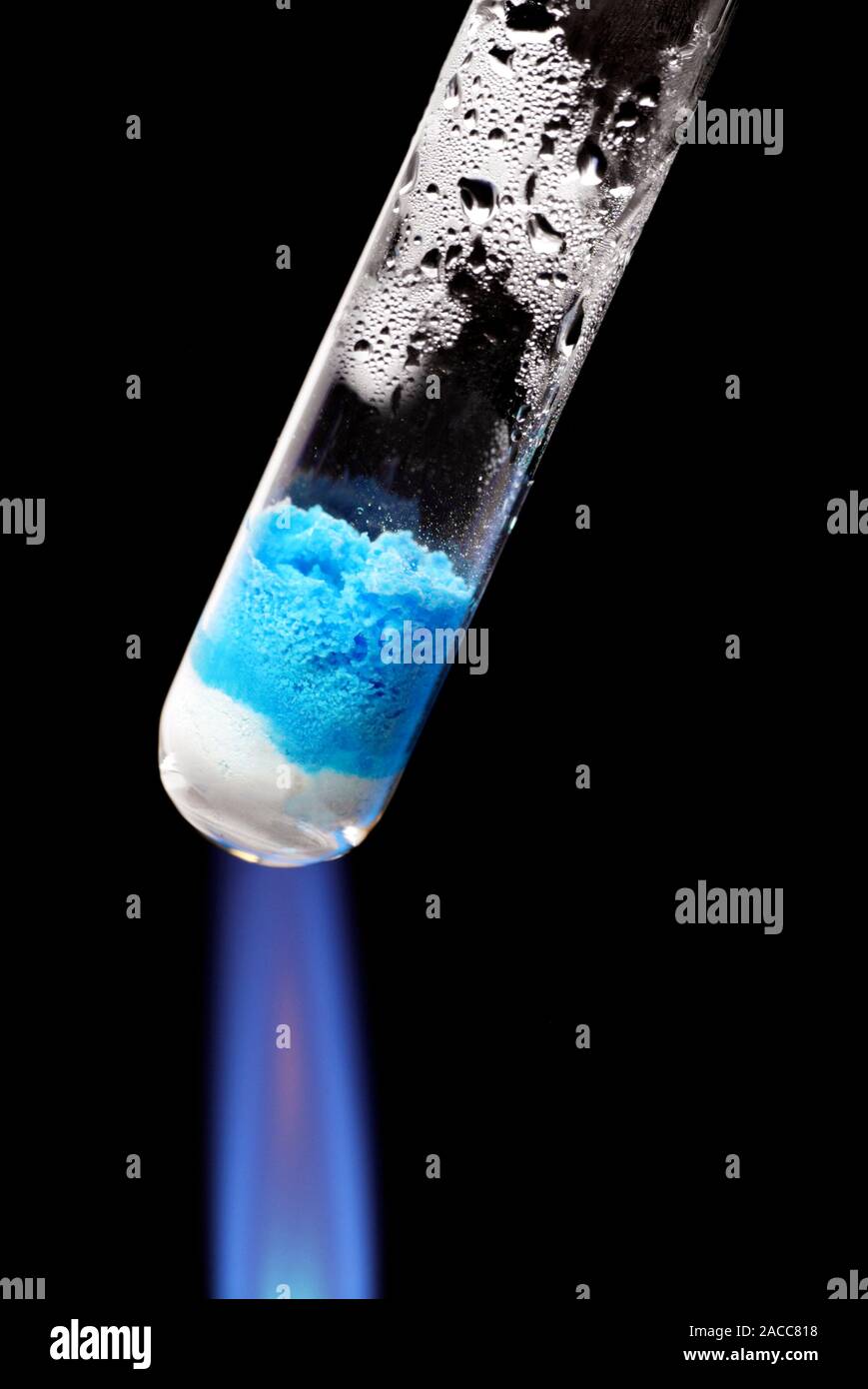 Copper (II) sulphate being heated in a test tube. In hydrated copper (II) sulphate (blue), water