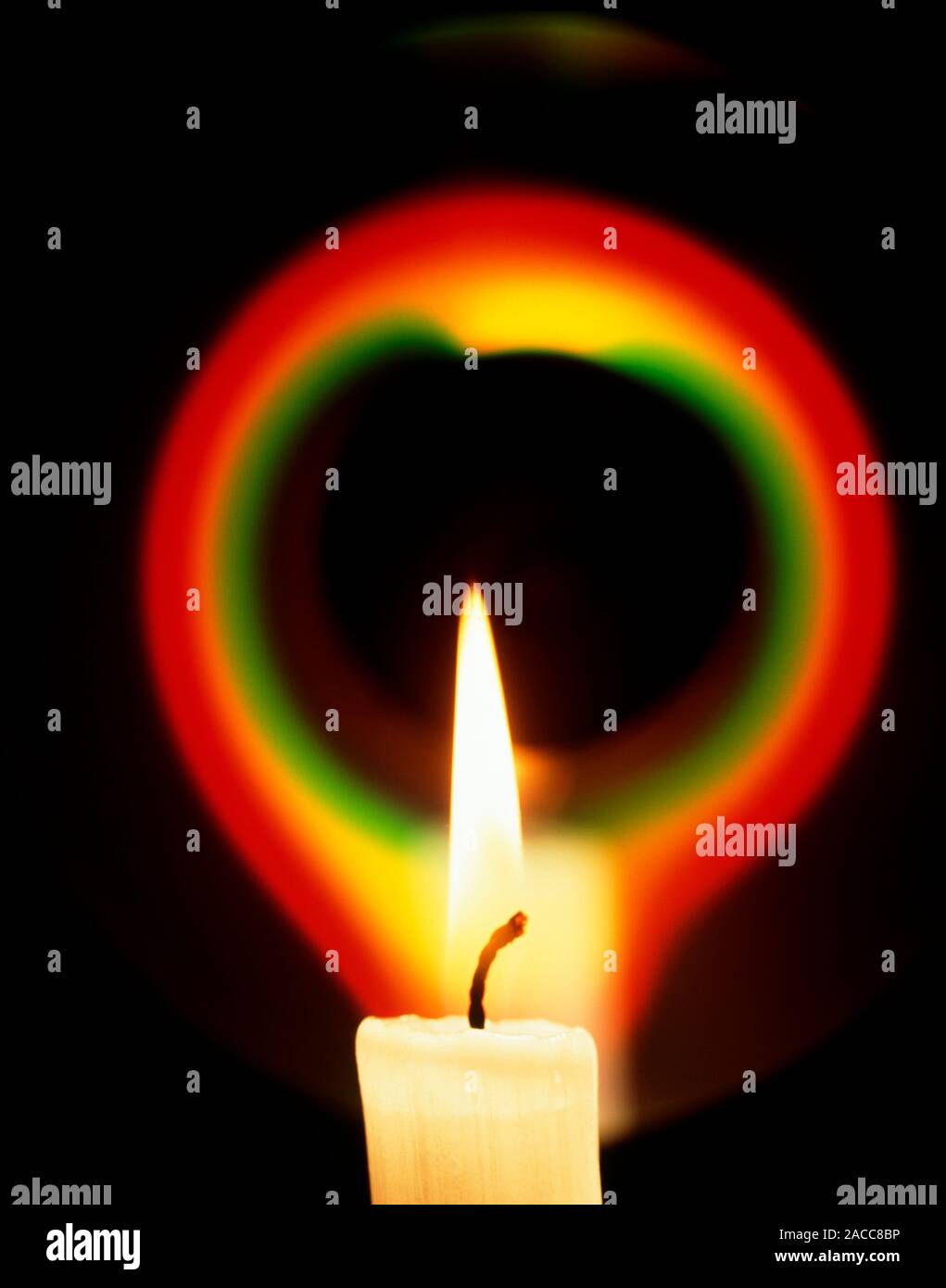Candle flame. Burning candle seen with a light pattern. A candle