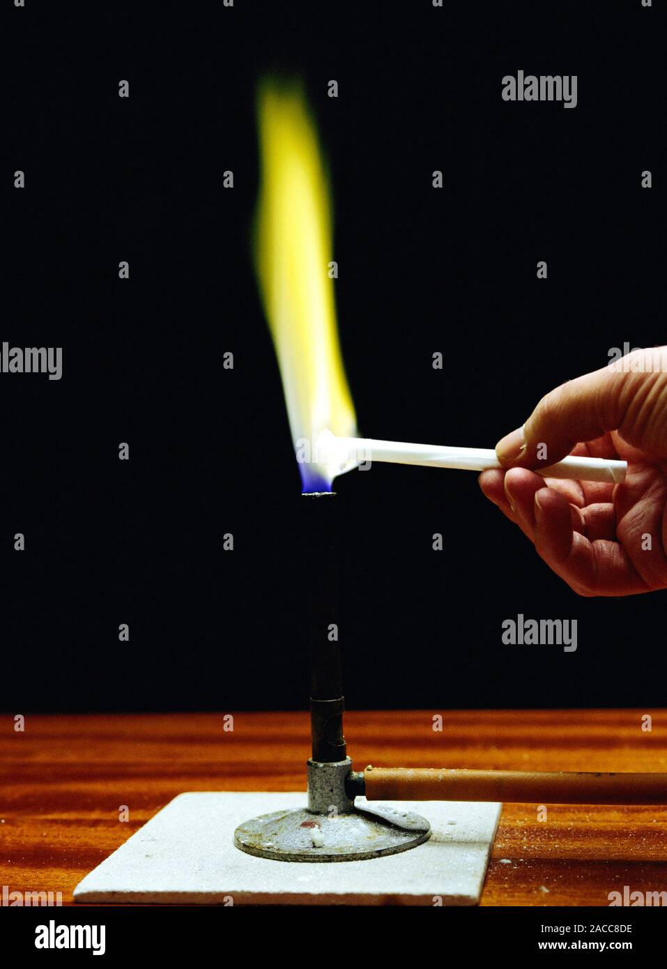 Flame test on sodium. Sodium compounds give a distinctive yellow colour