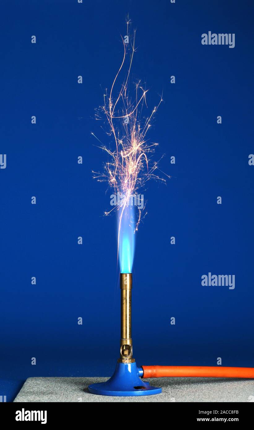 Iron filings in a bunsen flame. The heat of the flame allows the tiny