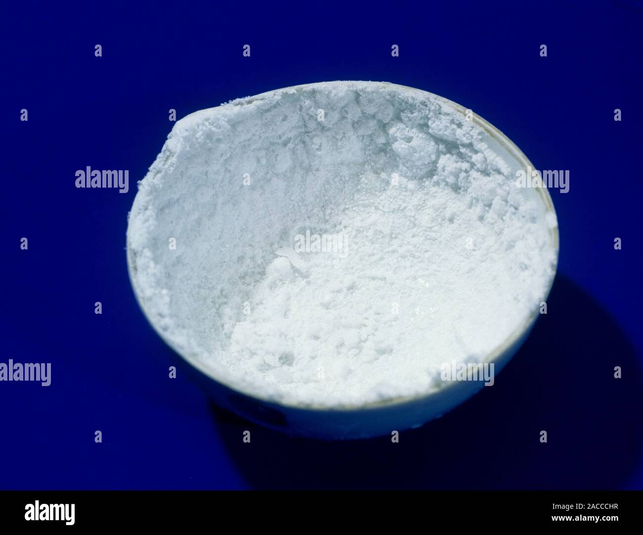 Salt crystals. Evaporating basin containing salt (sodium chloride, NaCl