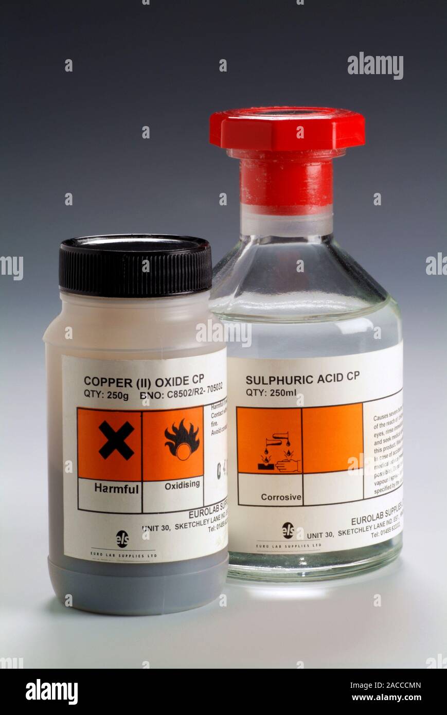 Copper oxide and sulphuric acid. Container of copper (II) oxide (left