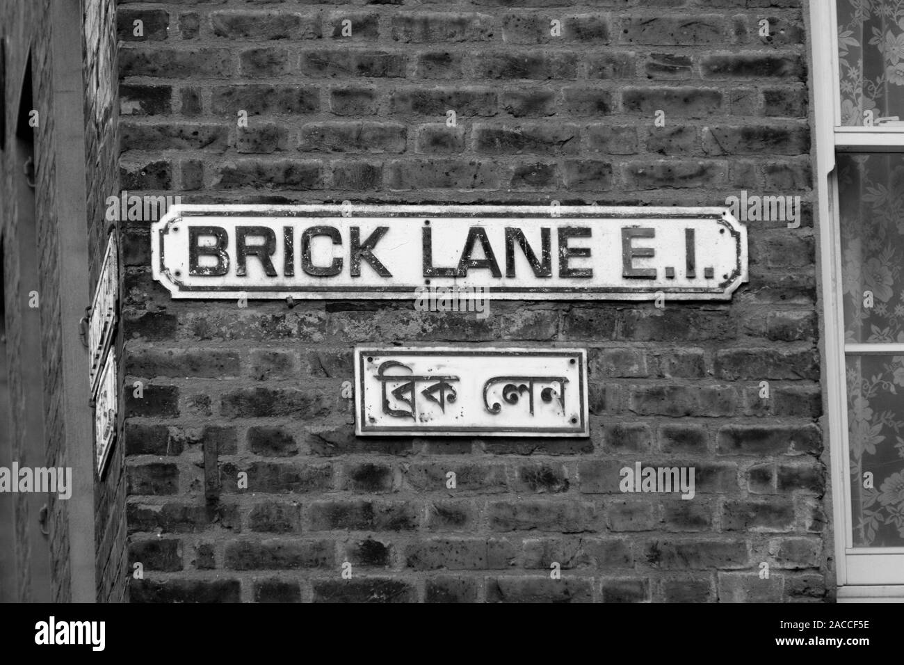 The famous Brick Lane street in the East End of London, England. The lane is also known as Banglatown and is a centre for the Bangladeshi community. Stock Photo